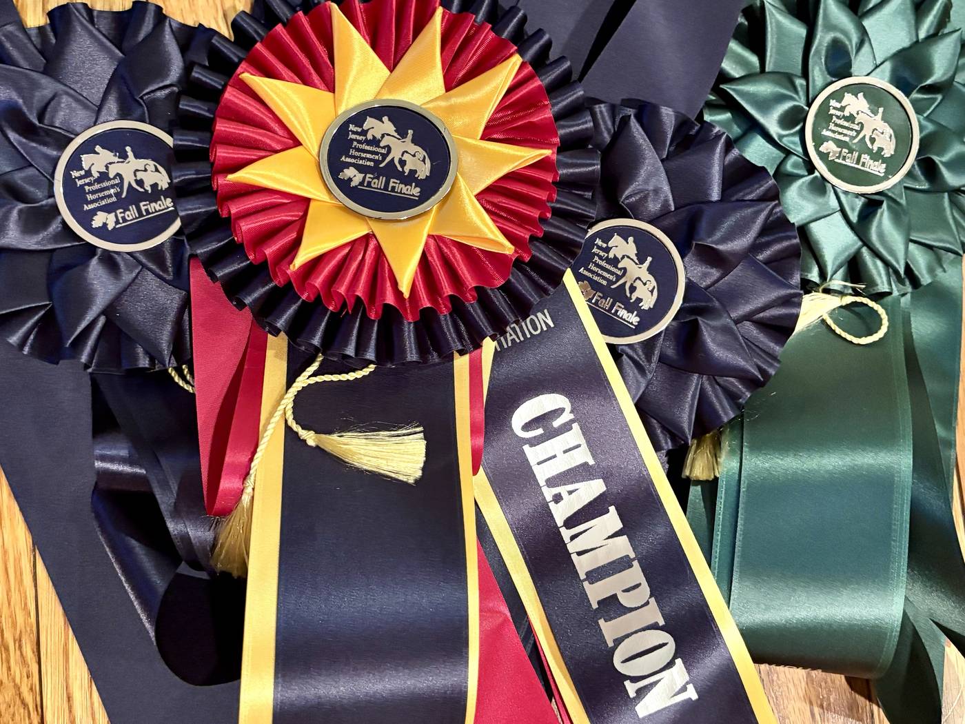 Champion and reserve ribbons from the New Jersey Professional Horsemen's Association Fall Finale
