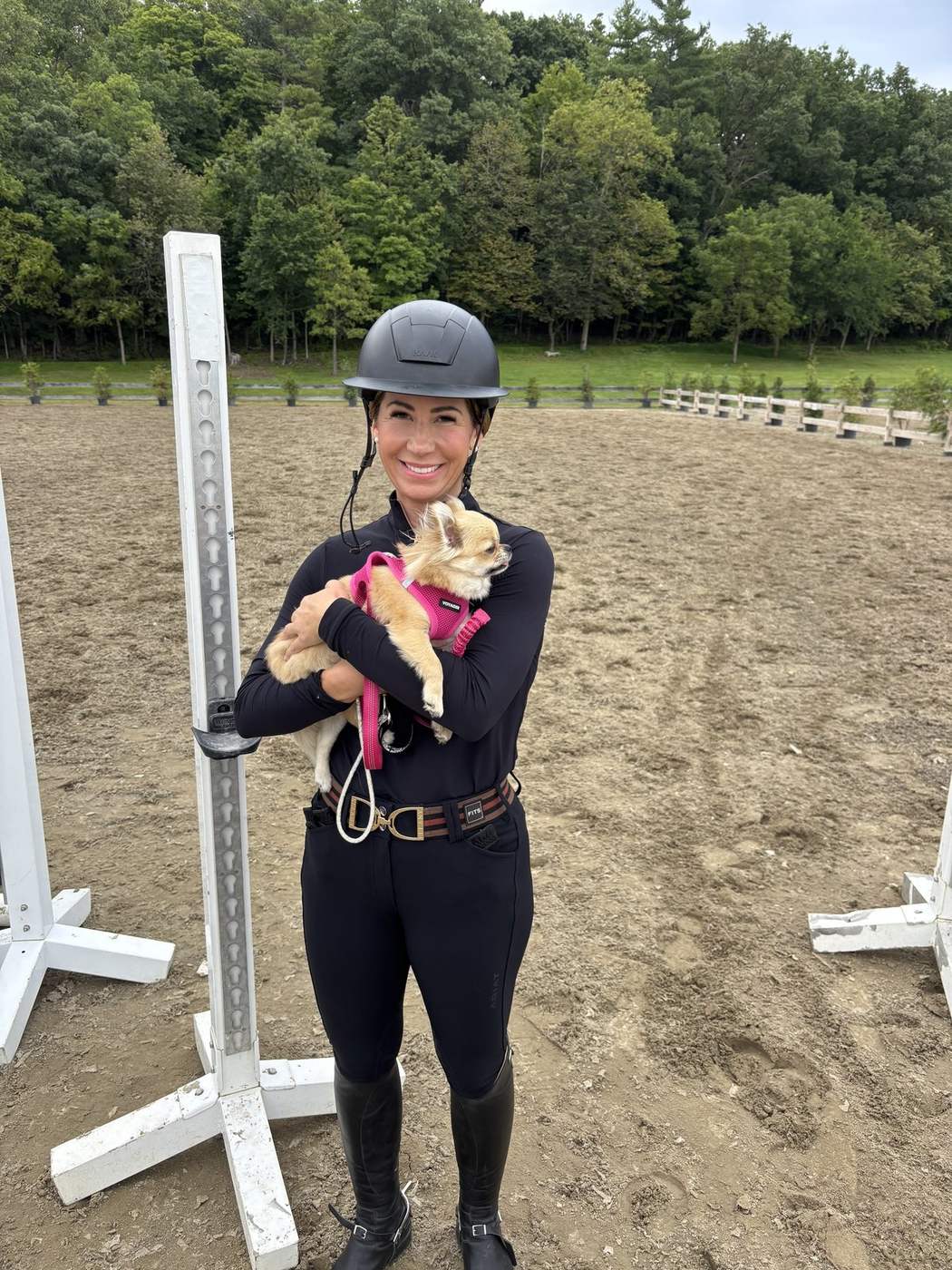 A rider with a championship ribbon in the ring