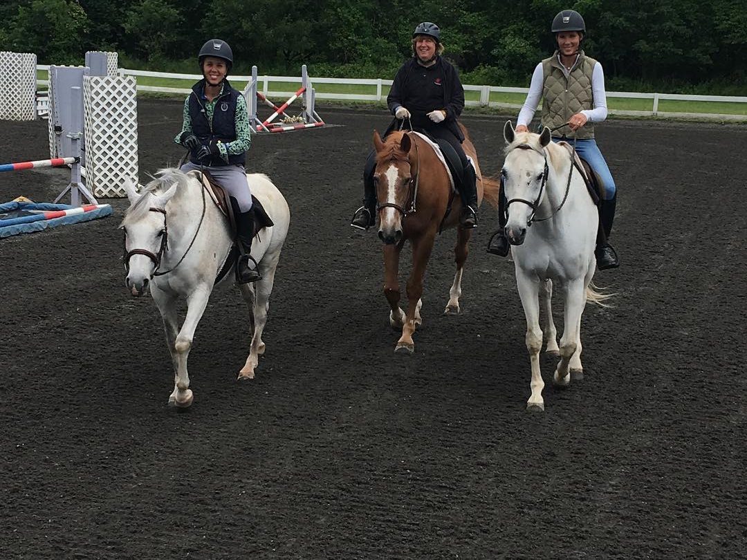A group riding lesson in progress in the arena in Whitehouse Station, Hunterdon County, New Jersey